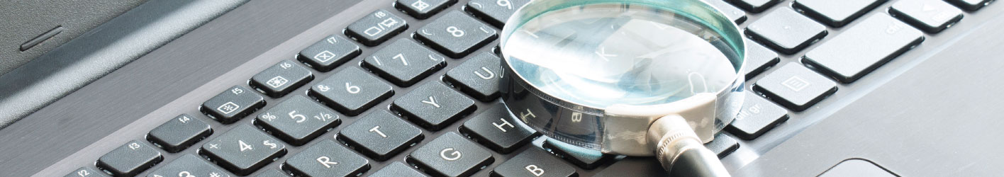 Magnifying glass on a keyboard