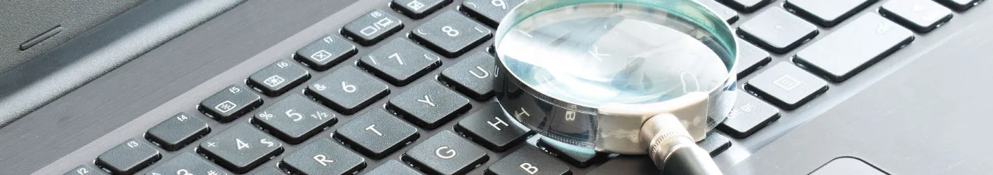Magnifying glass on a keyboard