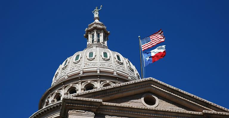 Government building with American Flag and Texas State flag flying