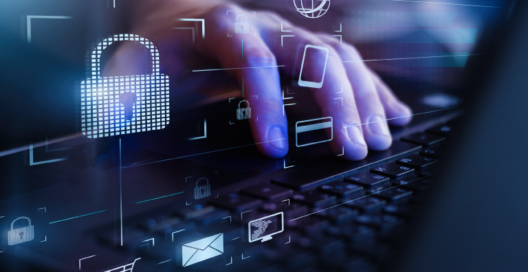 Laptop user typing with various security and tech icons
