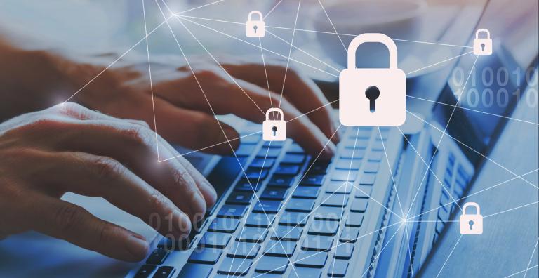 Individual types on computer with security lock icons