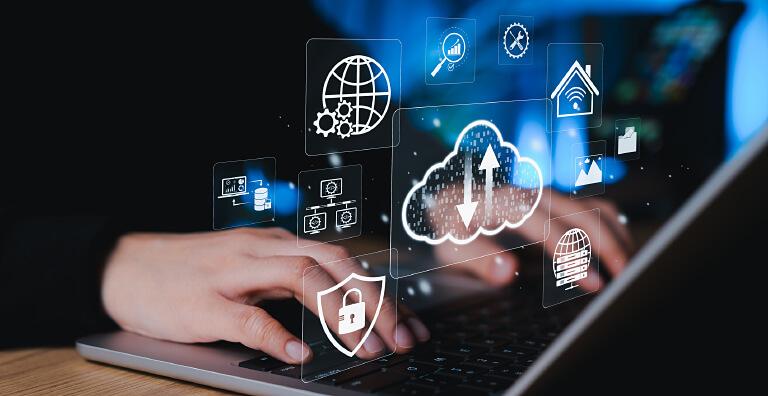Person using laptop with cybersecurity icons