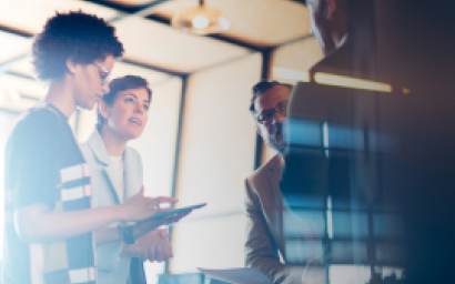 Four people in a meeting