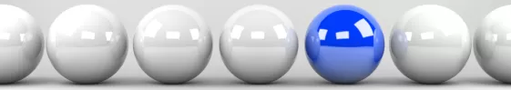 Pictures of bland color balls with one being blue.