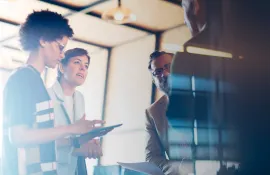 Four people in a meeting